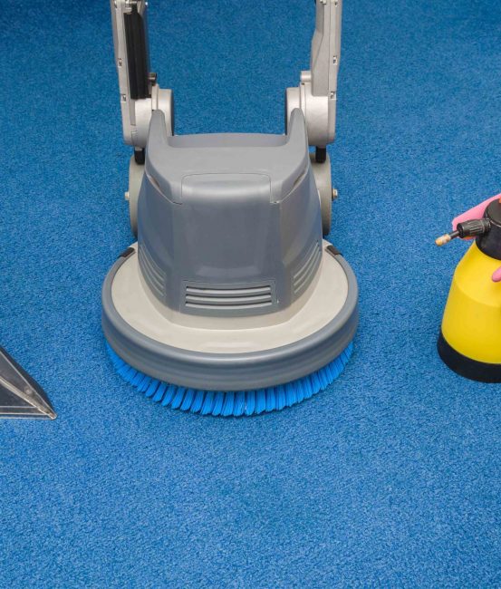 Disk machine, vacuum cleaner nozzle, spray bottle and rubber gloves for carpets professionally cleaning with extraction method. Early spring regular cleanup. Commercial cleaning company concept.